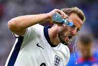 GELSENKIRCHEN, GERMANY - JUNE 30: Harry Kane of England sprays water over his face during the UEFA EURO 2024 round of 16 match between England and Slovakia at Arena AufSchalke on June 30, 2024 in Gelsenkirchen, Germany. (Photo by Michael Regan - UEFA/UEFA via Getty Images)