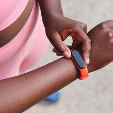 A photo of a woman wearing one of the best Fitbits