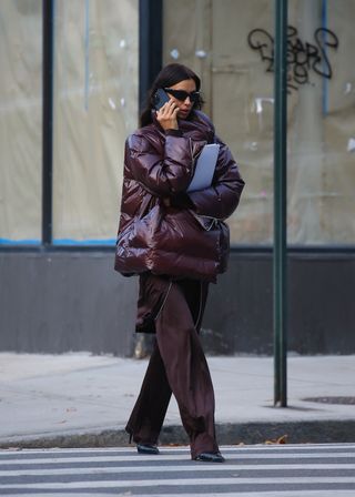 Irina Shayk in dark brown pants.