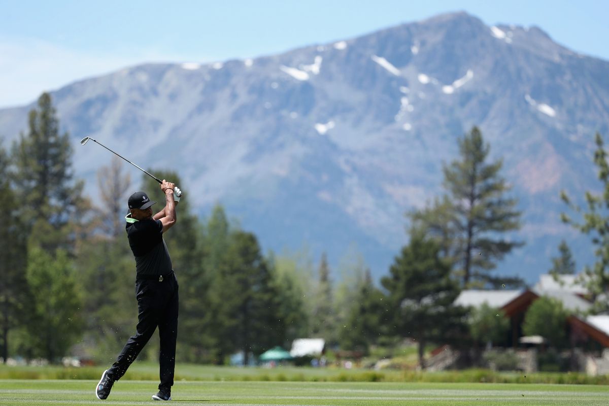  Former NBA athlete Dell Curry plays his second shot on the third hole during round one of the American Century Championship at Edgewood Tahoe South golf course on July 10, 2020 in Lake Tahoe, Nevada.