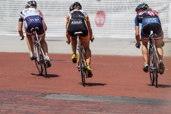 The three riders in the break begin to battle over who will pull.