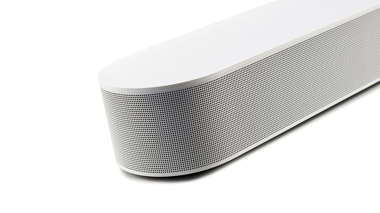 A close-up of the rounded-end of a white Sonos Beam Gen 2 on a white background