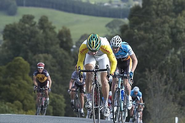 Peter McDonald (Drapac Porsche) leads the chasing peloton over the climb out of Lebrina.