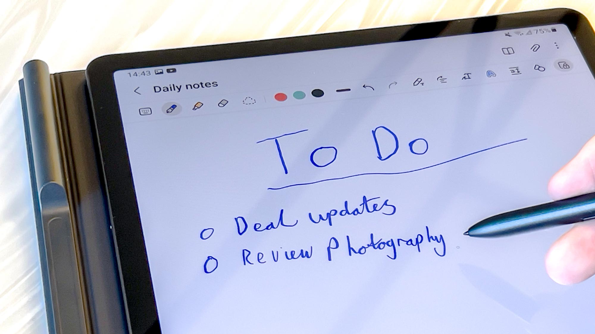 The Samsung Galaxy Tab S7 FE being written on with an S Pen
