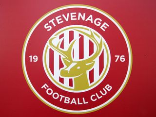 The Stevenage badge on a red background