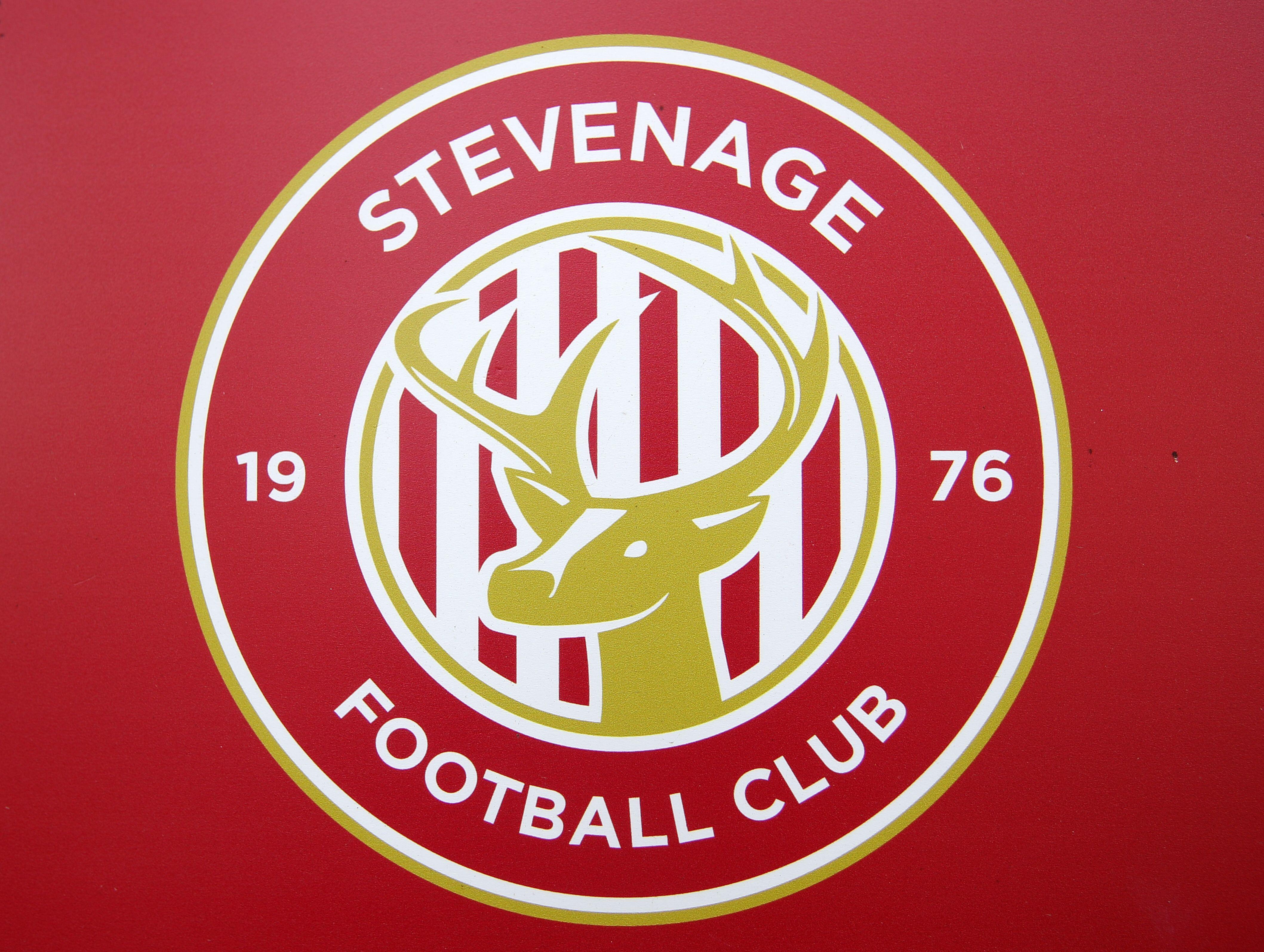 The Stevenage badge on a red background