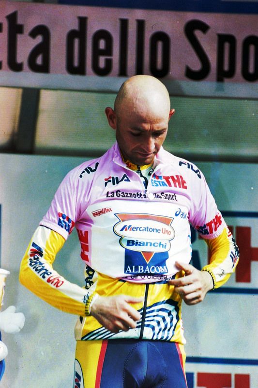 Marco Pantani pulls on the maglia rosa for the last time in his career after winning the 1999 stage to Madonna di Campiglio