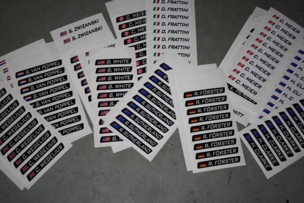 The riders' names on stickers which will go on the bikes.