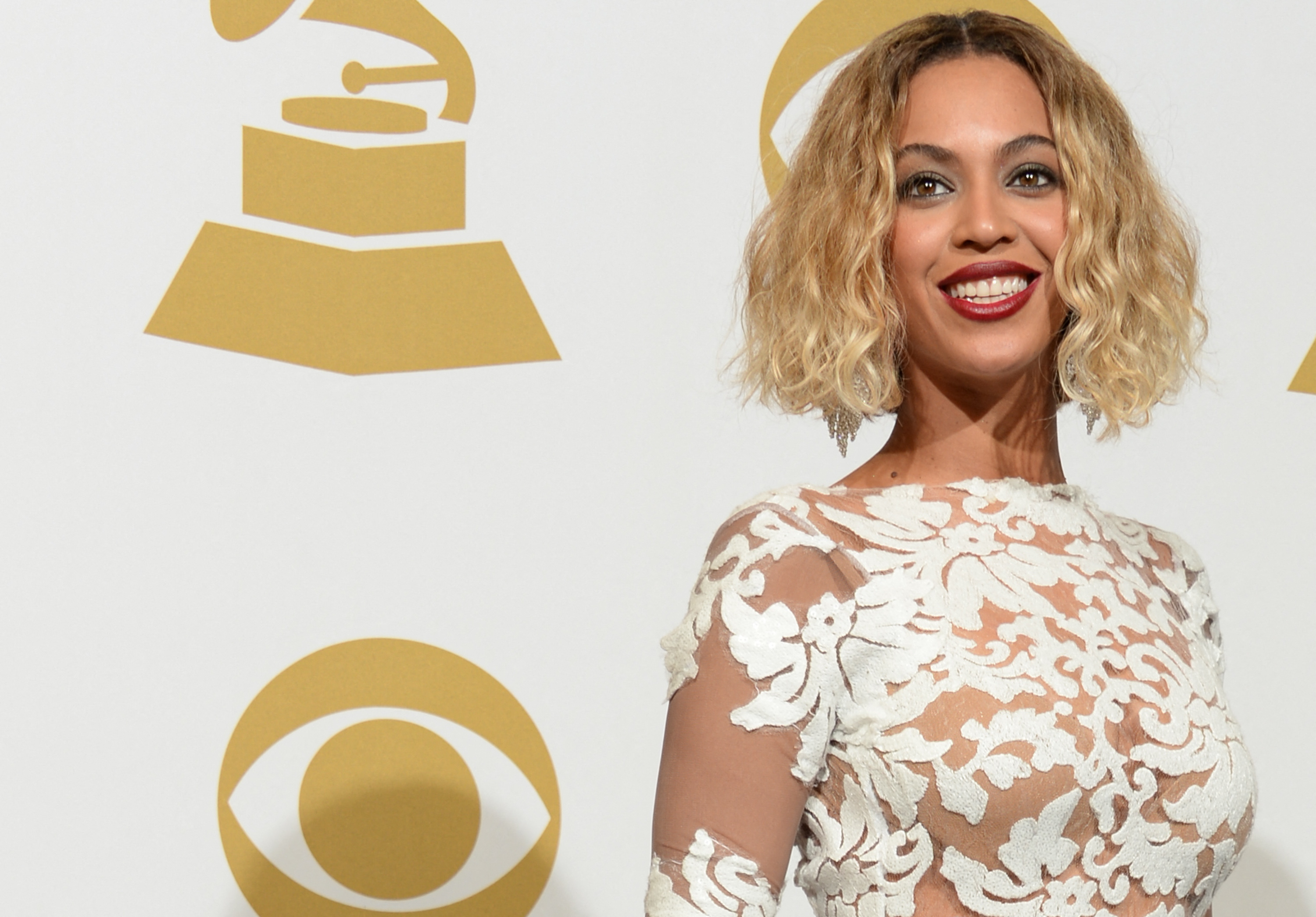 Singer Beyonce Knowles poses in the press room during the 56th Grammy Awards at the Staples Center in Los Angeles on January 26, 2014. AFP PHOTO/Joe KLAMAR (Photo by JOE KLAMAR / AFP)