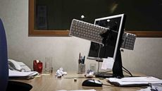 A keyboard is thrown through a monitor