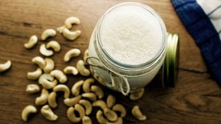 image shows a glass of cashew milk