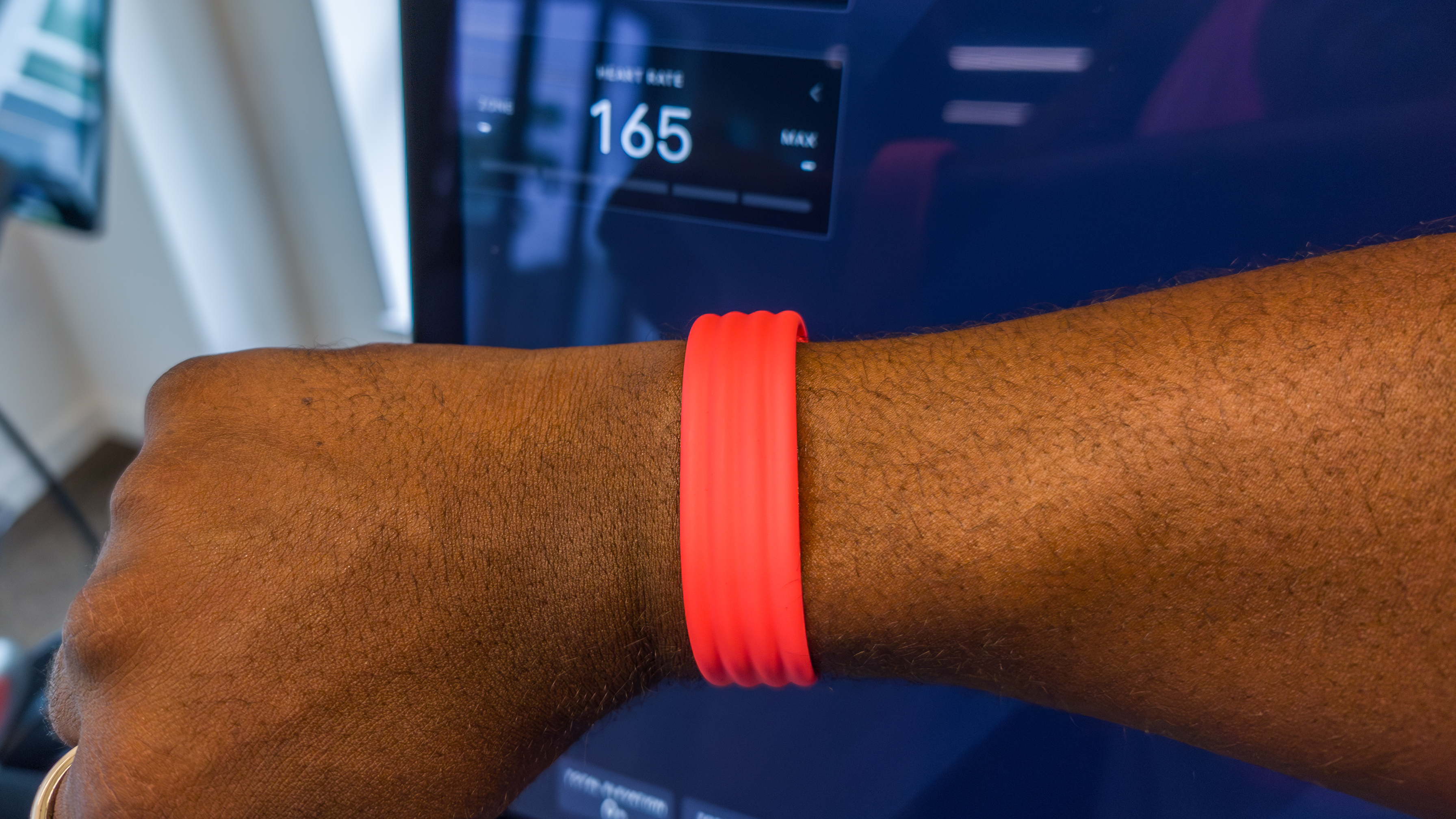 The Fitbit Air with live heart rate tracking on a Peloton