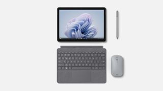 The Microsoft Surface Go 4 with type cover, Surface Pen, and mouse.