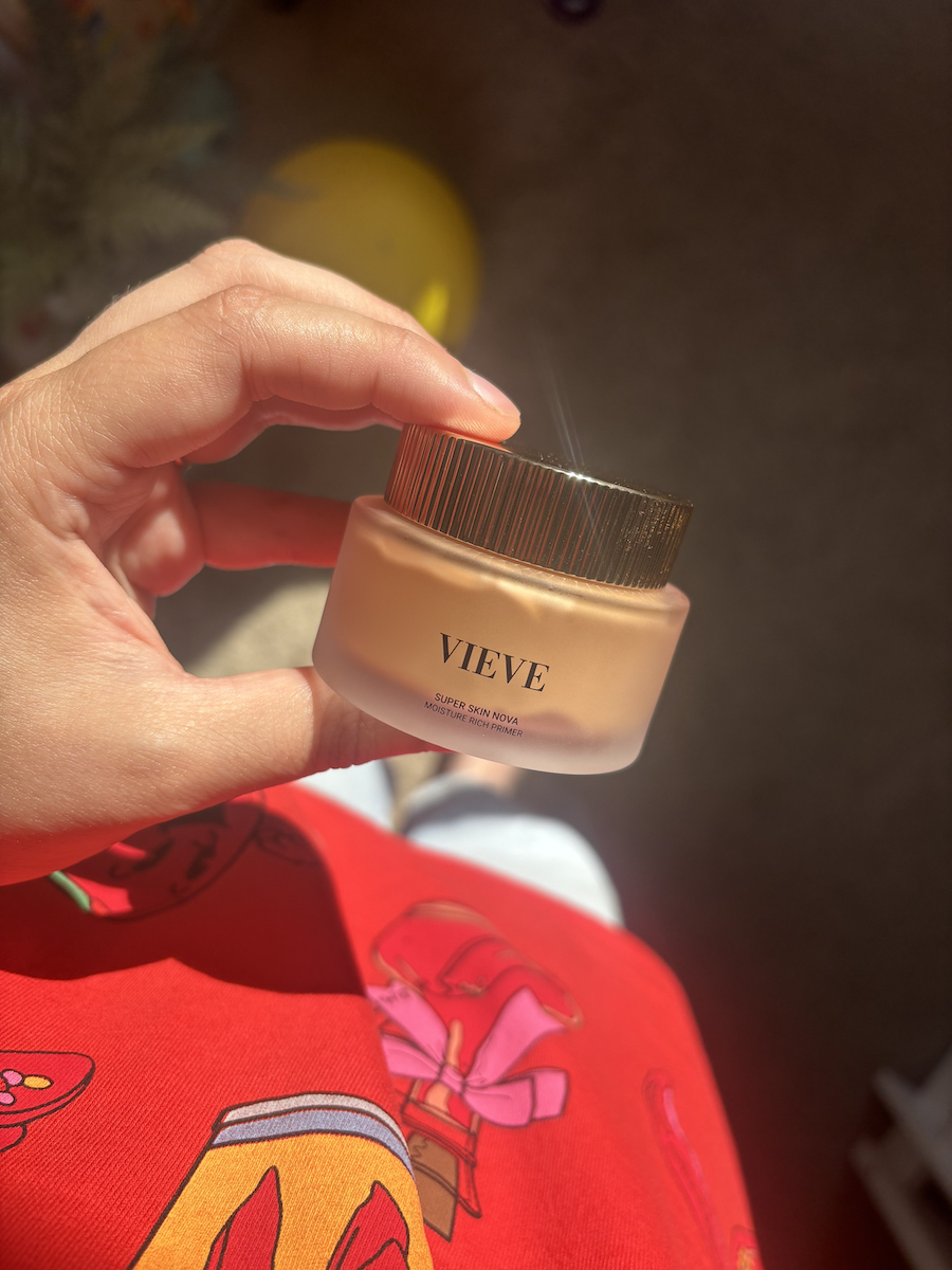 Mica Ricketts holding pot of Vieve Super Skin Nova