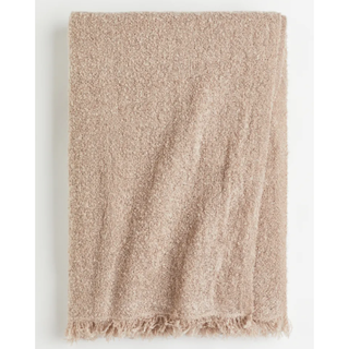beige boucle throw blanket with fringing