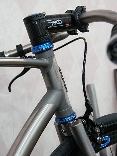 The frame is TIG-welded but careful masking and blasting yields a faux lugged look.