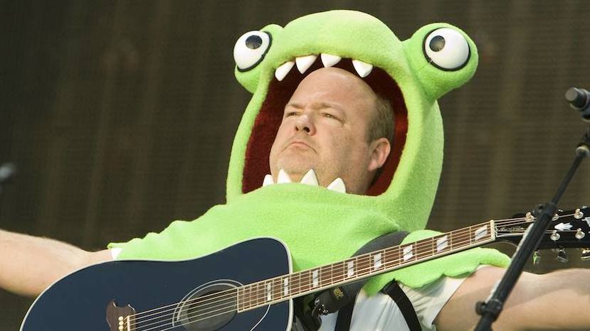 Kyle Gass of Tenacious D onstage dressed as a green monster