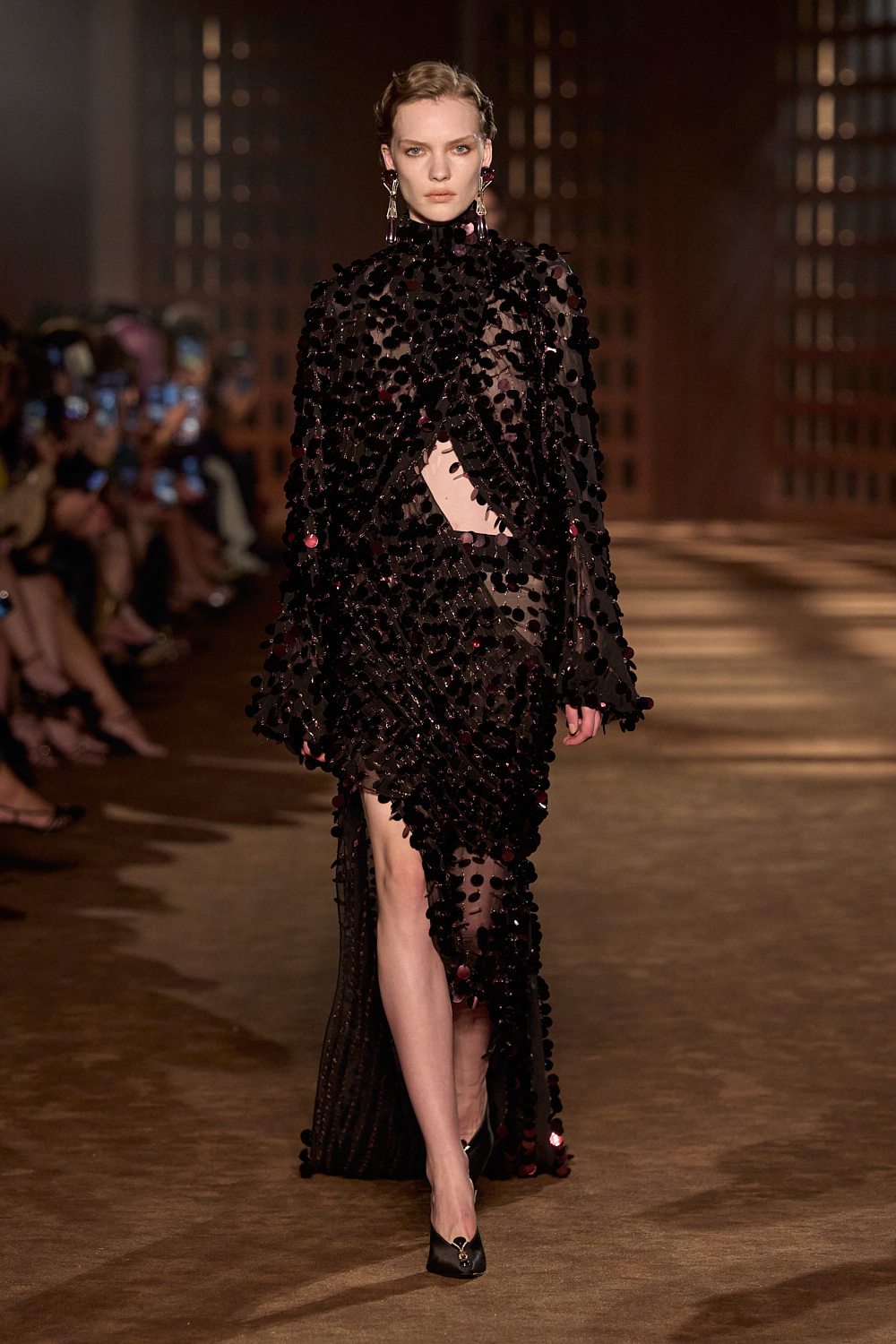 a model walks the ferragamo spring 2027 runway.