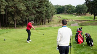 Nick Dougherty watching Golf Monthly reader Andy Edom teeing off on the 11th at Wentworth