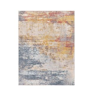 A blue, pink, and yellow abstract rug