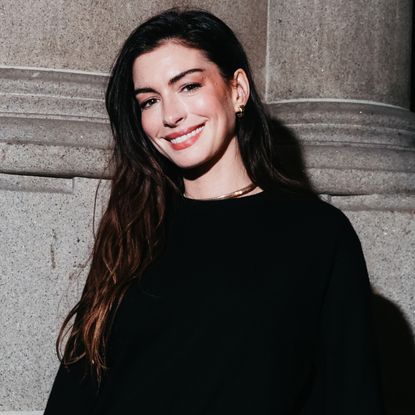 Anne Hathaway got "arrested" during Sabrina Carpenter's Madison Square Garden concert while wearing a black corset, jeans, and a Bulgari watch