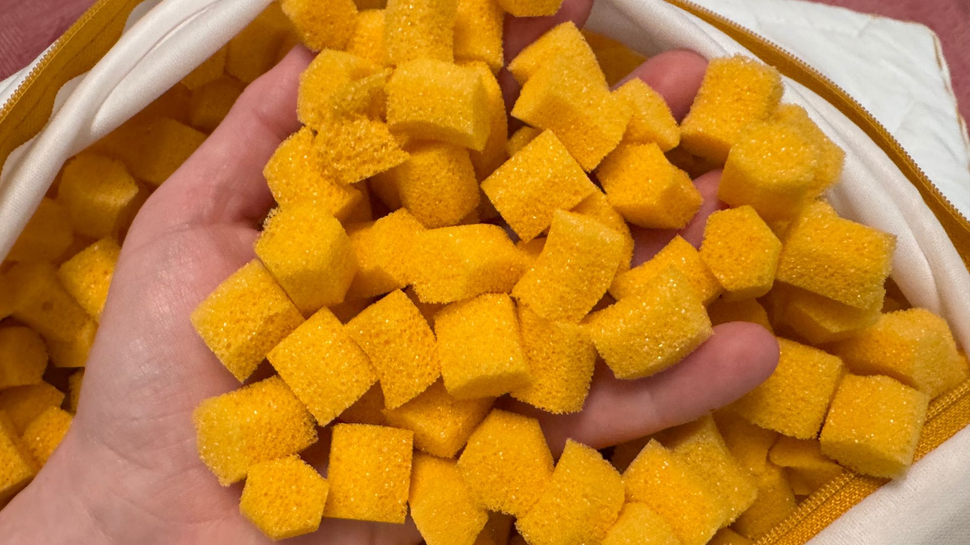 HoneyFoam&amp;trade; Adjustable Pillow Review - the memory foam clusters pictured in the tester's hands