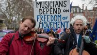 A violinist and cellist play opposite the UK parliament to protest against Brexit and how musicians will be hampered as they travel around the EU for concerts and performances, on 10th January 2019