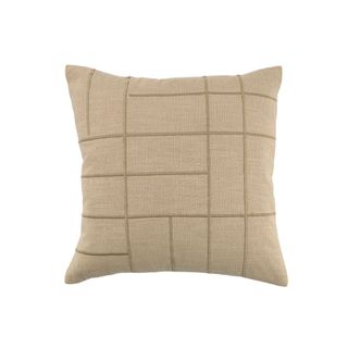An outdoor patio cushion in taupe