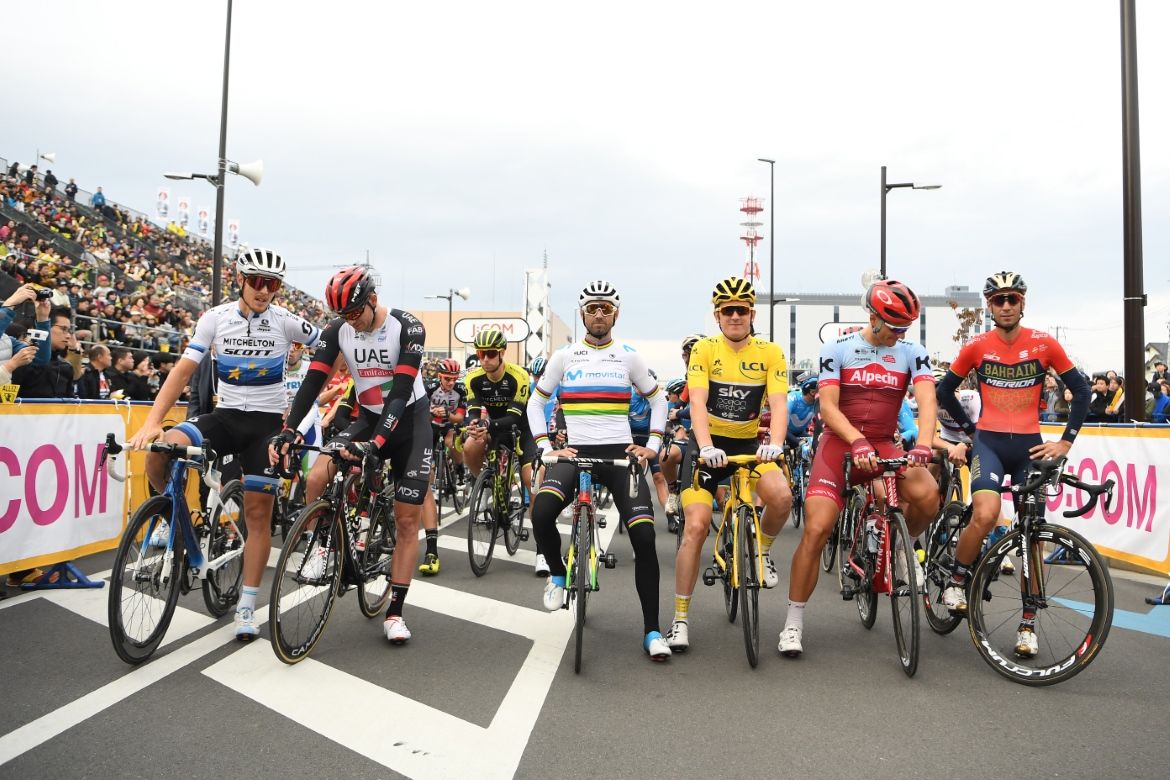 The riders line up on the start line