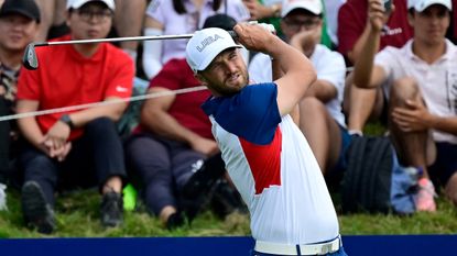 Wyndham Clark hits an iron shot during the final round of the Paris 2024 men&#039;s Olympic golf tournament at Le Golf National