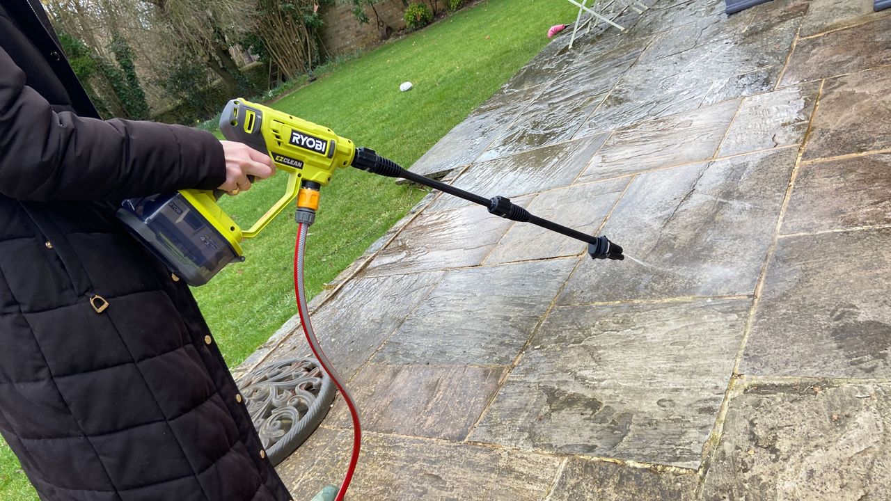 Image shows the Ryobi ONE+ 18V Cordless Power Cleaner.