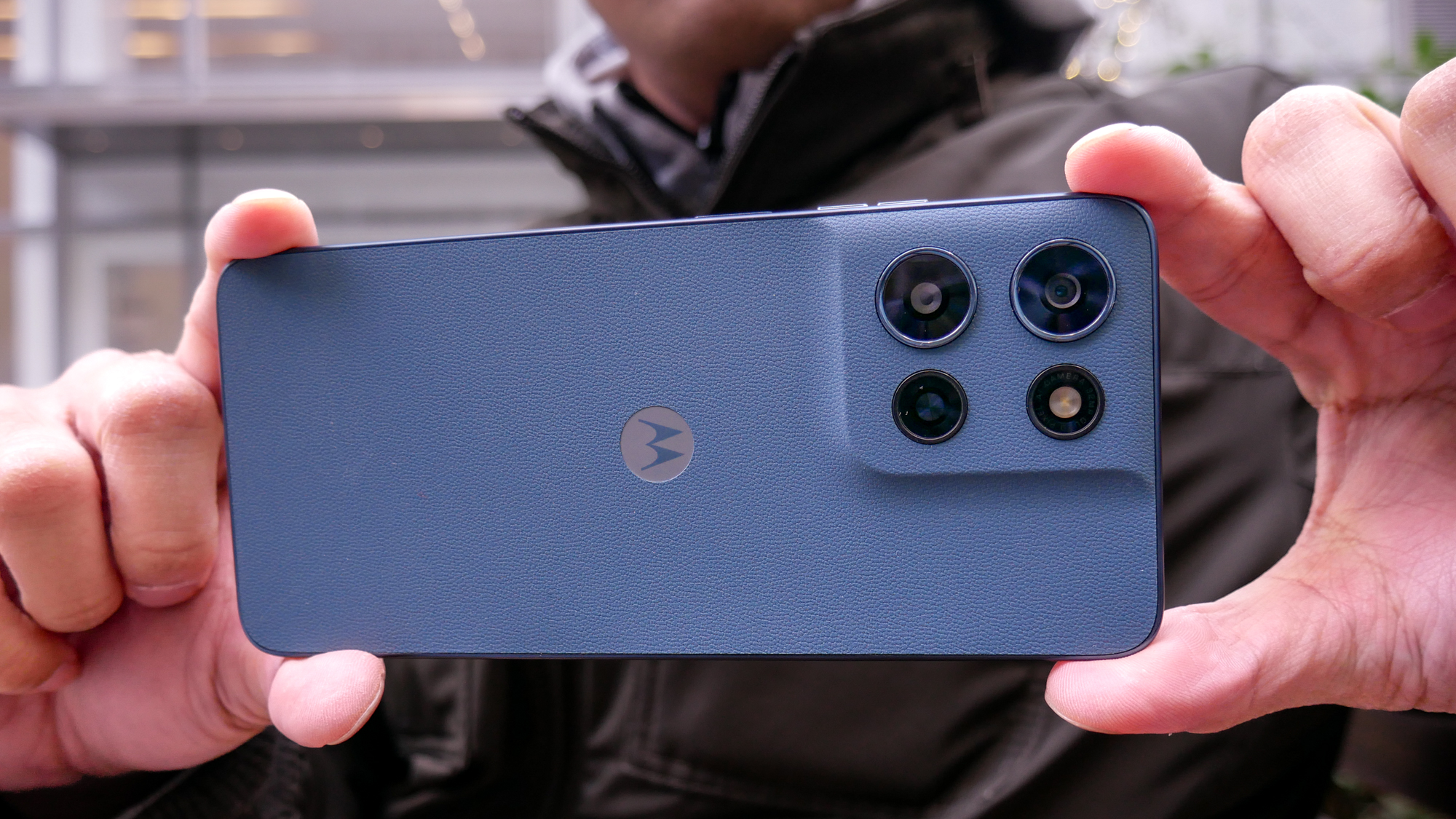 Motorola Moto G Play (2026) held in the hand to take a photo.