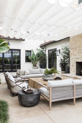 an outdoor seating area with shade cover