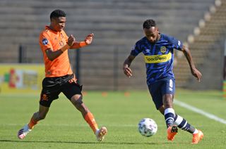 Mpho Makola is challenged by Vincent Pule