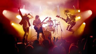 Rock Band 4 header image - four-person band on stage in front of a crowd