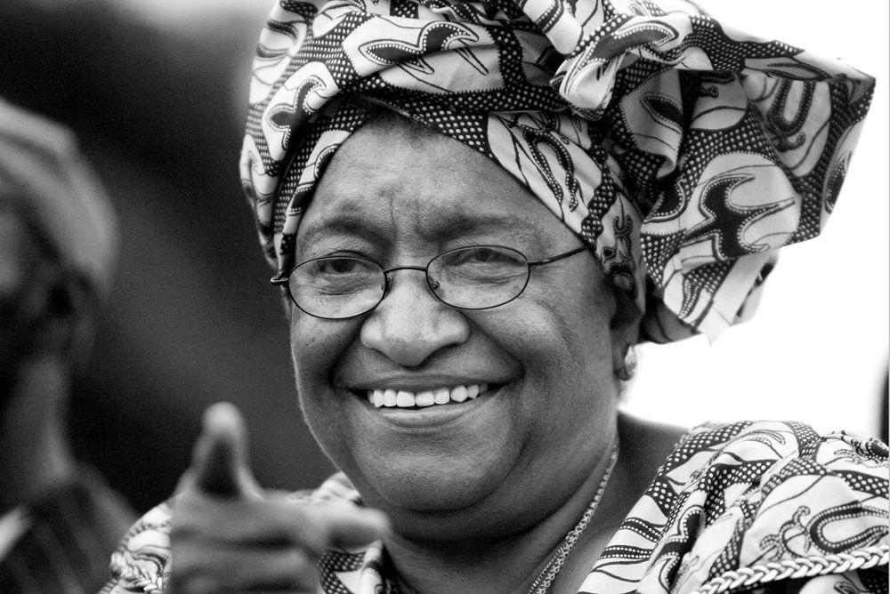 MONROVIA, LIBERIA - NOVEMBER 06:Presidential candidate Ellen Johnson Sirleaf waves to supporters during a support parade November 6, 2005 in Monrovia, Liberia."Ellen," as she universally know