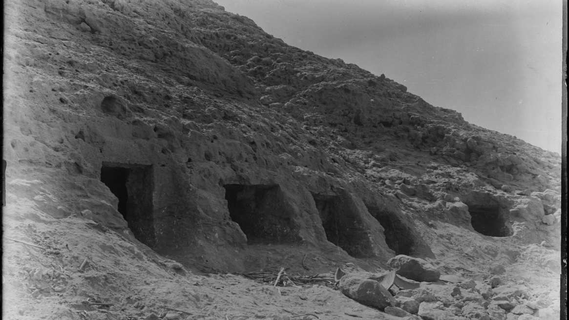 Rock-cut tombs in black and white.
