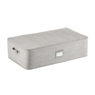 A light grey marled fabric zip-up storage container with a built-in label holder and handles
