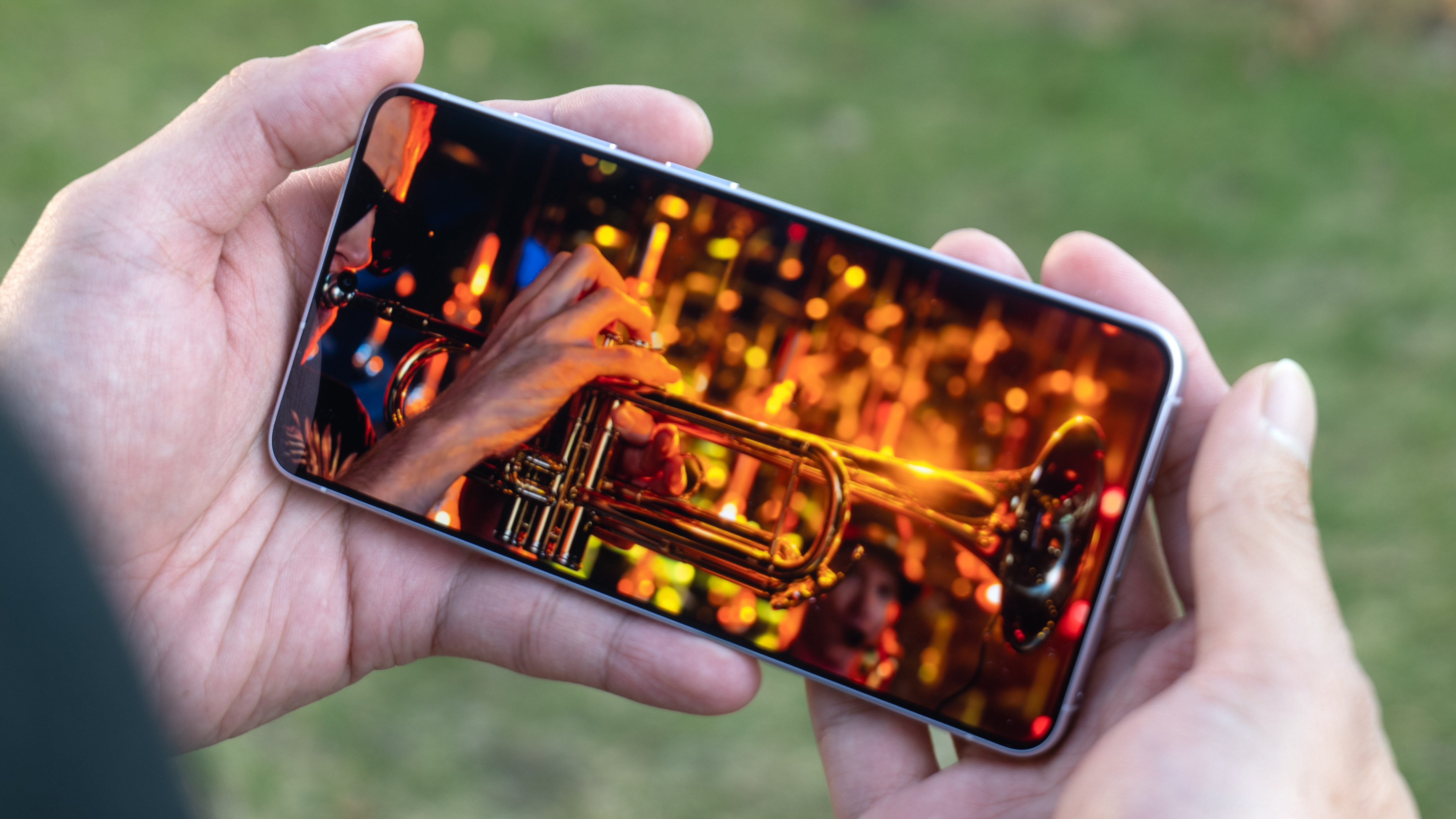 Samsung Galaxy S26 held in the hand playing 4K HDR video.