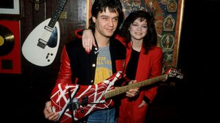 Eddie Van Halen of the rock group Van Halen stands with his wife Valerie Bertinelli February 18, 1995 in New York City. Van Halen donated his guitar to vice president Eric Crisman to be displayed at the Hard Rock Cafe. 