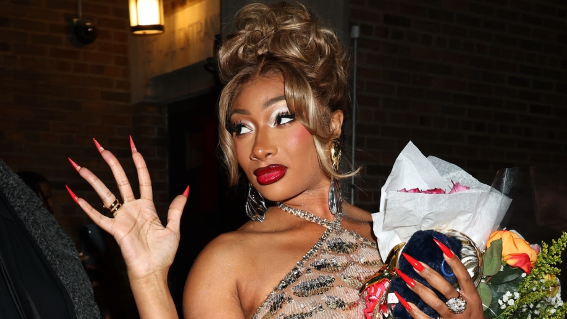 Megan Thee Stallion switched her Moulin Rouge costume for a semi-sheer sequin dress after her Broadway debut