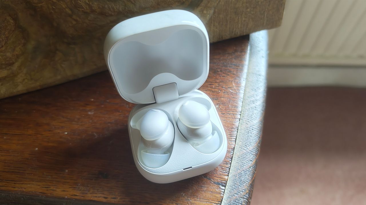 The open charging case for a pair of white Sony LinkBuds Fit in-ear headphones, with the buds themselves visible inside.