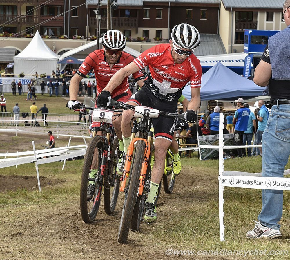 Mathias Flueckiger (Thomus-RN Racing Team) and Florian Vogel (Focus XC Team)