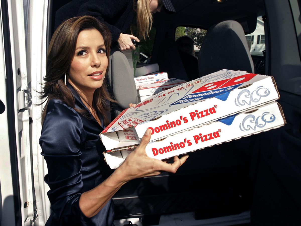 Eva Longoria supports striking writers with pizza