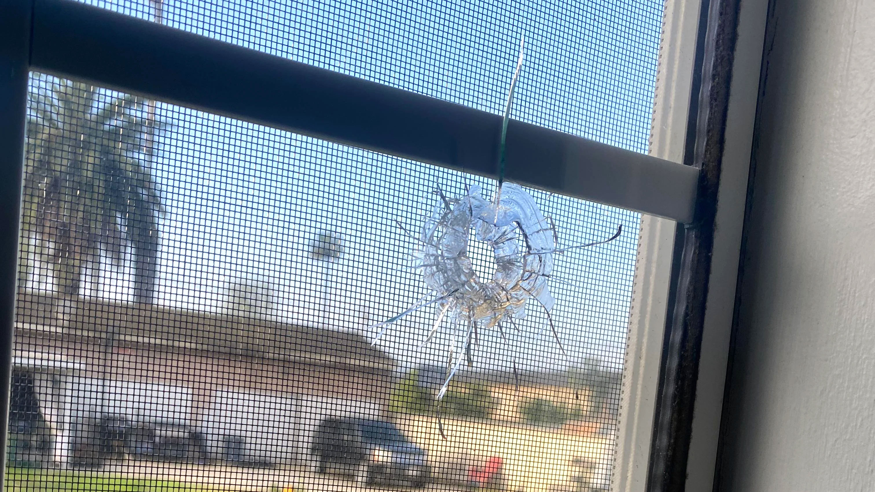 A window with a bullet hole