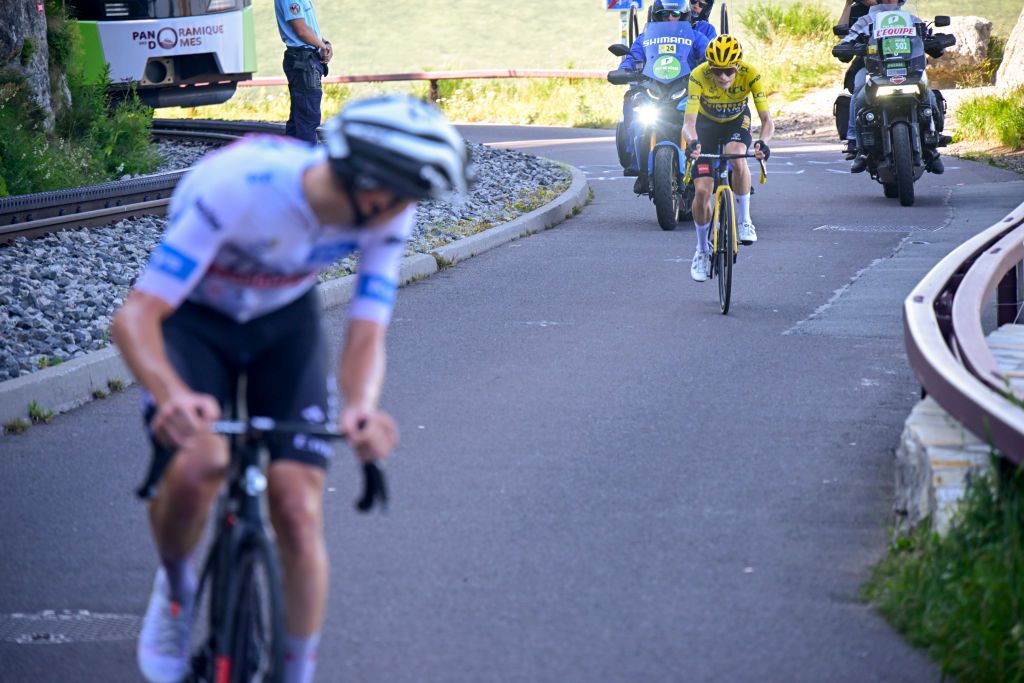 PUY DE DME FRANCE JULY 09 LR Tadej Pogacar of Slovenia and UAE Team Emirates White Best Young Rider Jersey attacks to Jonas Vingegaard of Denmark and Team JumboVisma Yellow Leader Jersey during the stage nine of the 110th Tour de France 2023 a 1824km stage from SaintLonarddeNoblat to Puy de Dme 1412m UCIWT on July 09 2023 in Puy de Dme France Photo by Bernard Papon PoolGetty Images