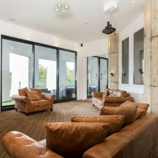 living room with leather sofa and sliding door