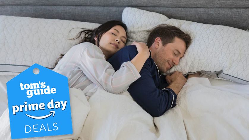 Best Prime Day deals for side sleeper pillows, featuring a couple sleeping with Coop Sleep Goods Original Adjustable Pillow