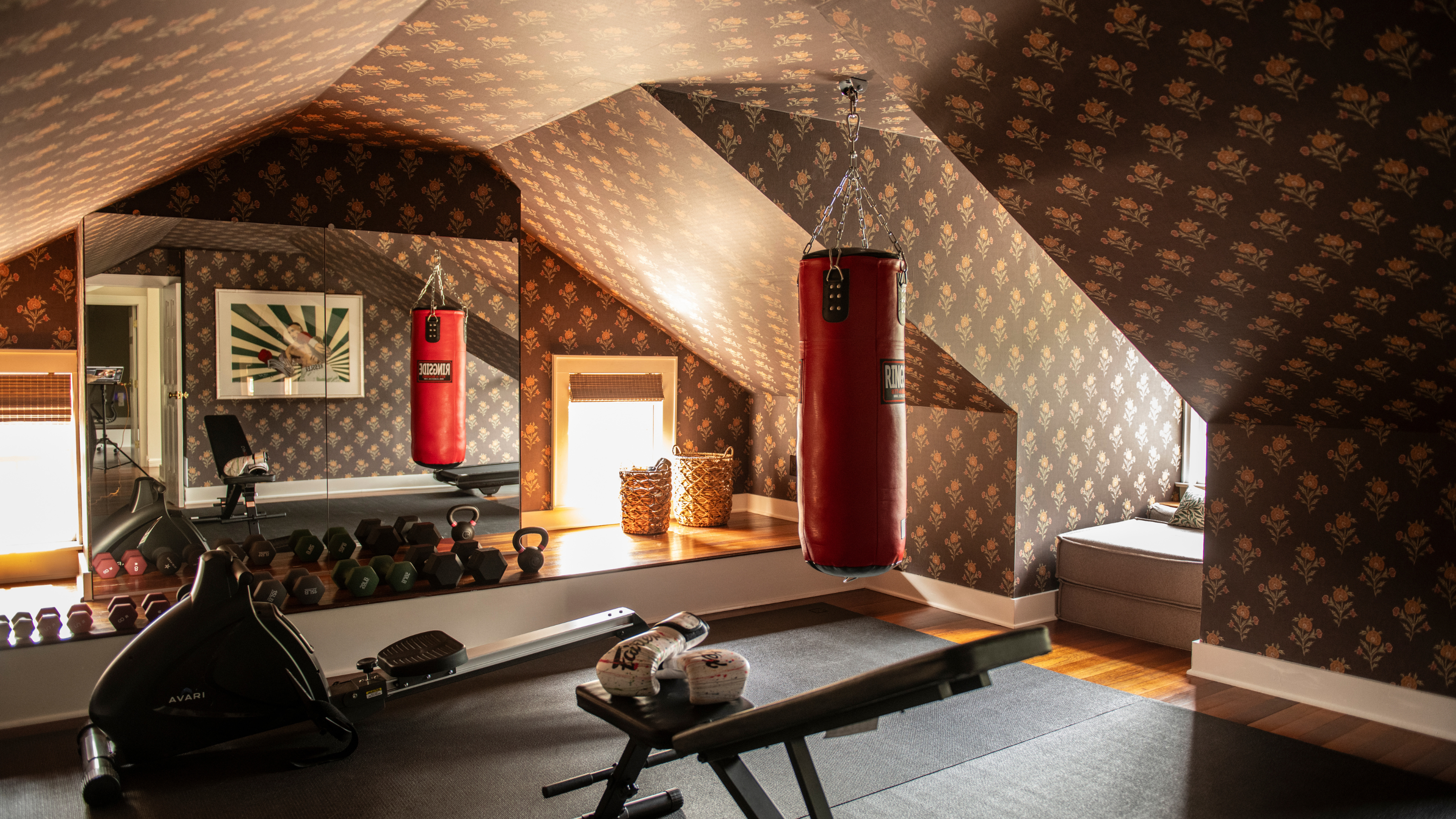 Charming gym featuring floral wallpaper and modern wall art