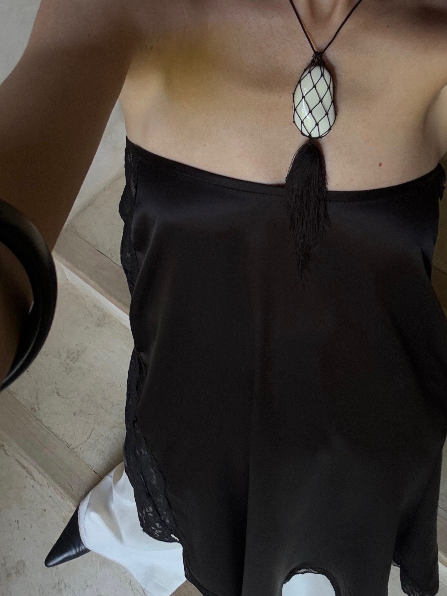 Woman wearing a summer 2026 jewelry trend.